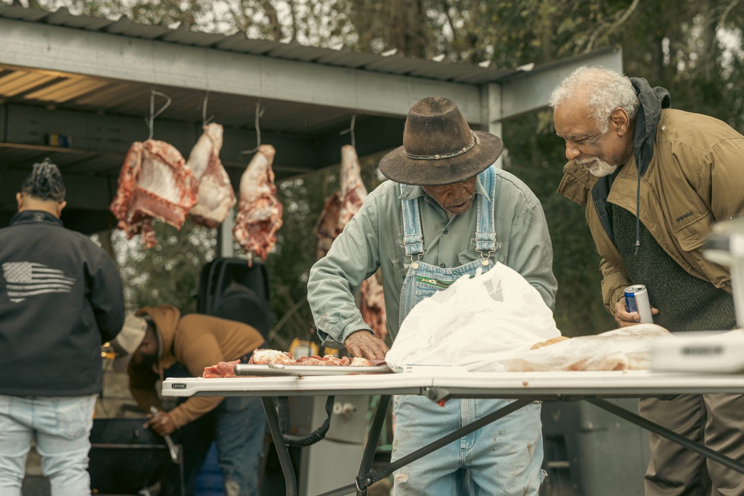 Creole elders at a boucherie in The Old Way Still Cuts