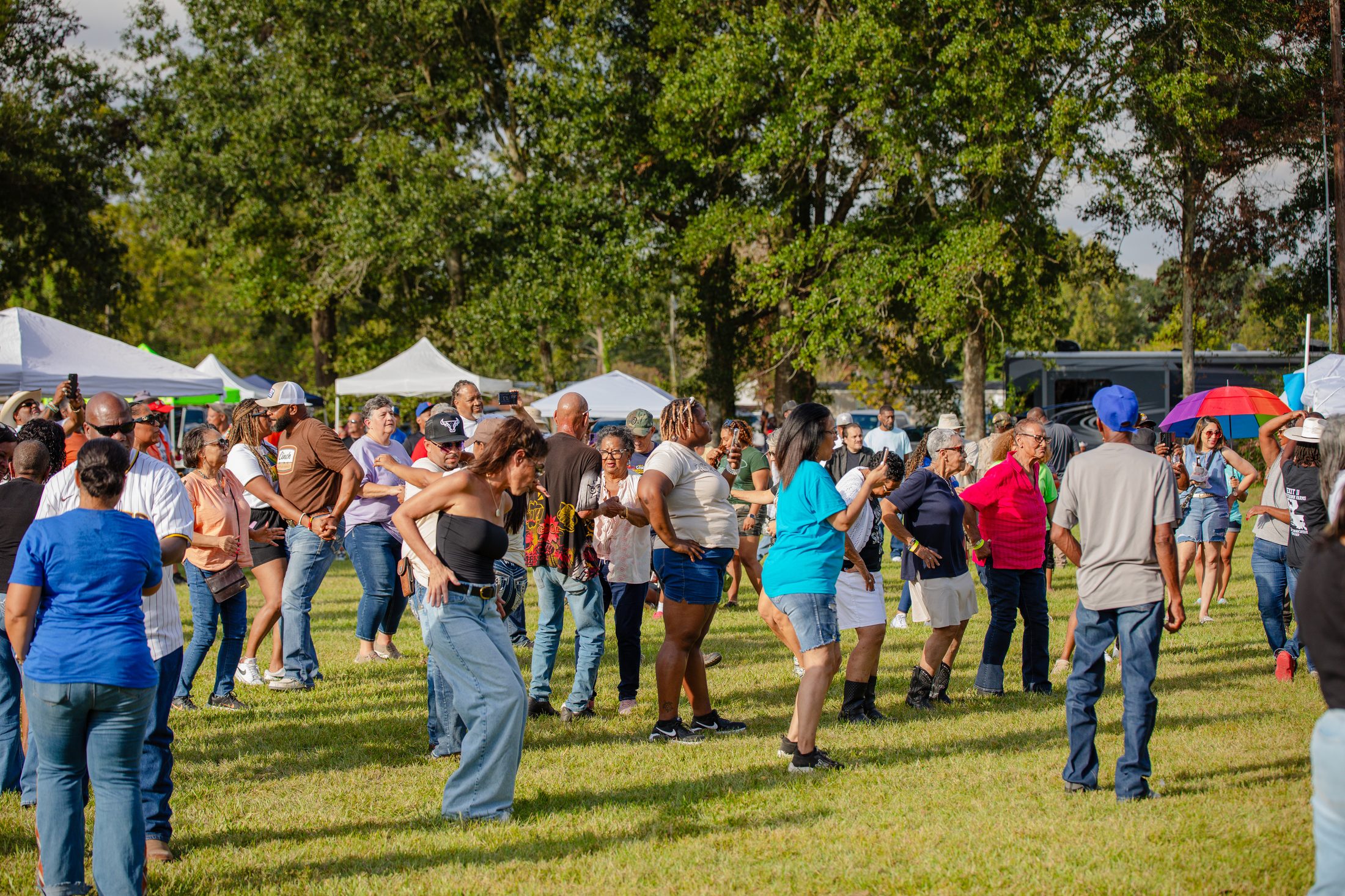 The community dancing together at Creole Culture Day in Grand Coteau