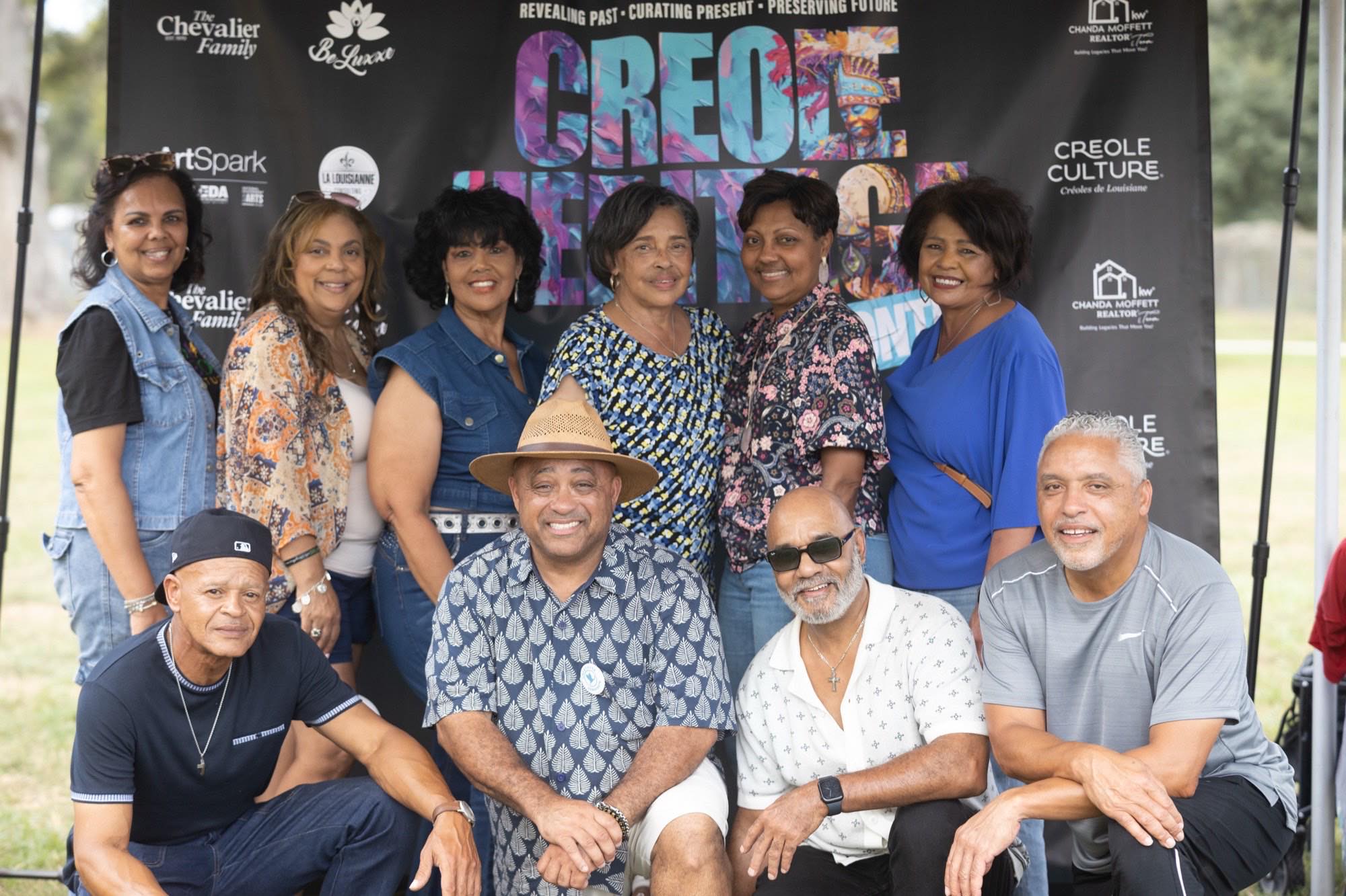 The community gathered at the Creole Heritage backdrop at Creole Culture Day in Grand Coteau